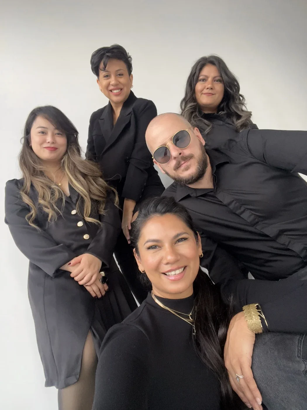 Federico and the photography team together behind the scenes at a studio shoot.