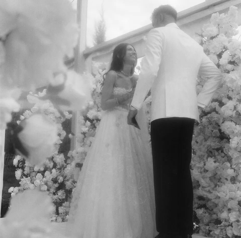 The ceremony, framed by flowers — Rolleiflex 6×6